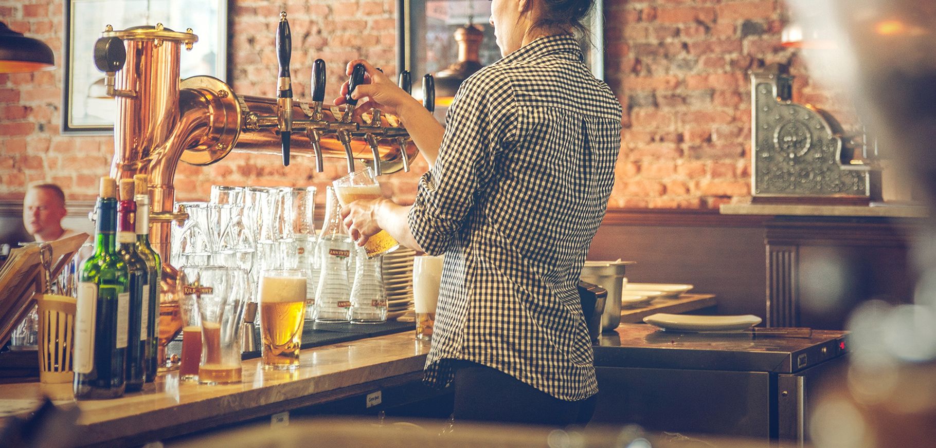 bartender pouring a beer