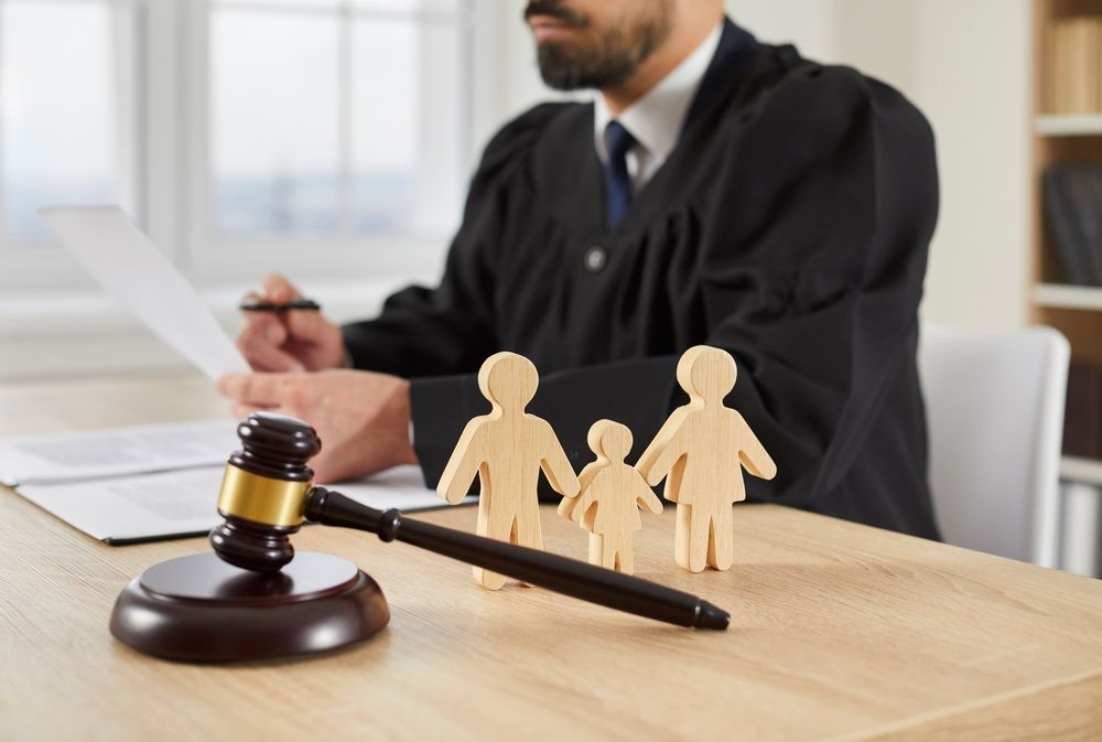 Family law and divorce concept, featuring legal symbols and family imagery representing legal matters and relationships.