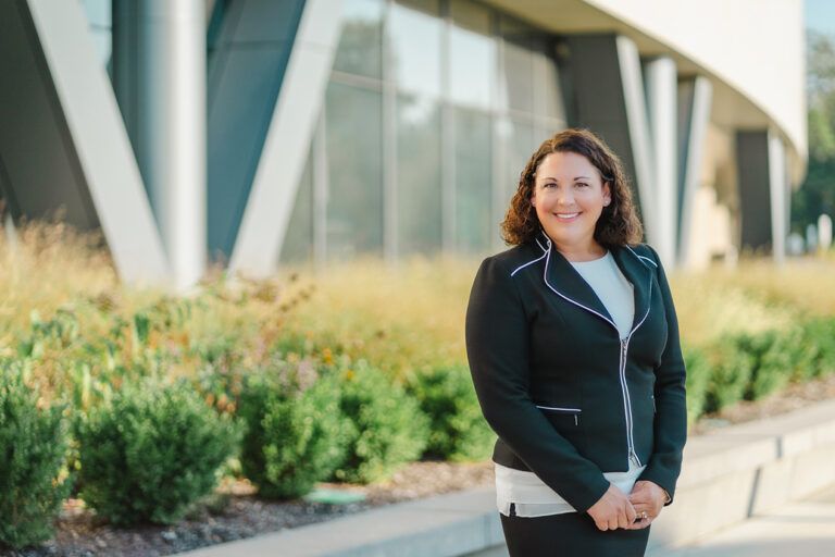 Professional licensure defense attorney Diane Bellquist in front of Johnson County District Courthouse in Olathe, KS