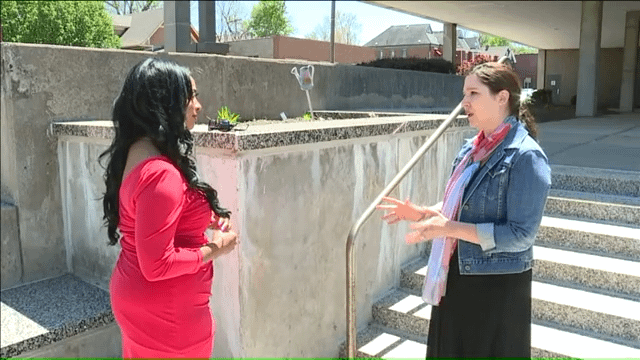 Kansas City family law attorney Christine Rosengreen speaks with Fox 4 news reporter about Cradles to Crayons program in front of Jackson County Family Courthouse.