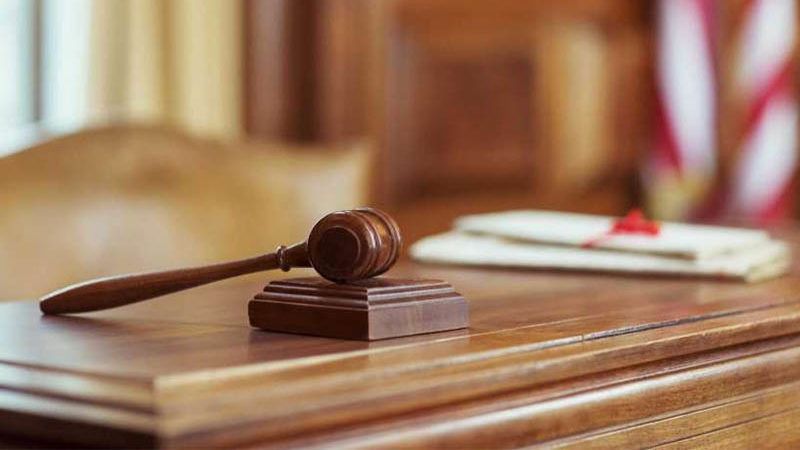 judge's gavel on courtroom desk