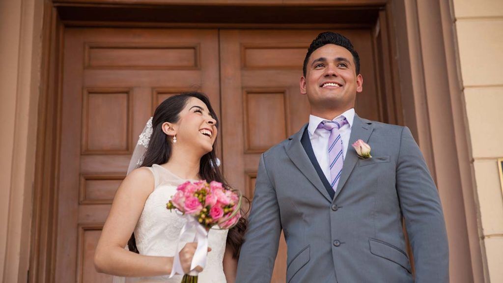 happy couple on courthouse steps just married