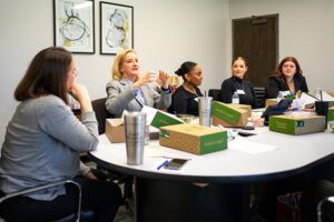 JHC attorneys talking with students from UMKC Law School around the conference room table at JHC's Overland Park office