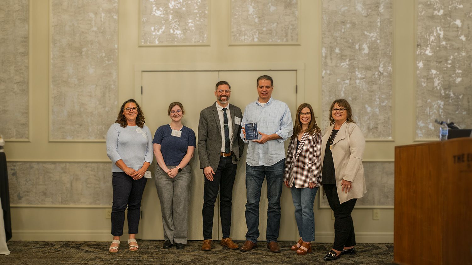 
                    JHC CLE team members (left to right) Diane Bellquist, Luzianne Stafford, Matt Stephens, Chris Joseph, and Carrie Parker stand with KSCLE spokesperson Cindy Chaffin after she presented the Robert L. Gernon Award to them.